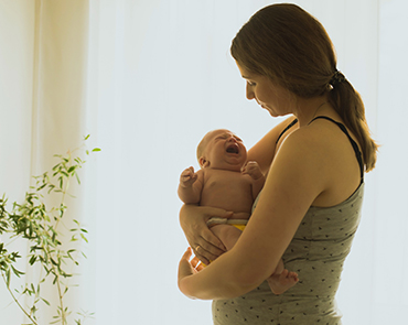 Woman holding a newborn baby